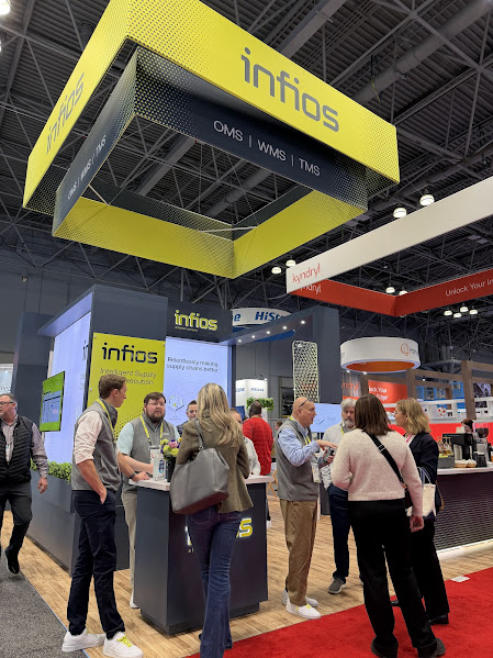 Infios branded booth with overhead signage at trade show